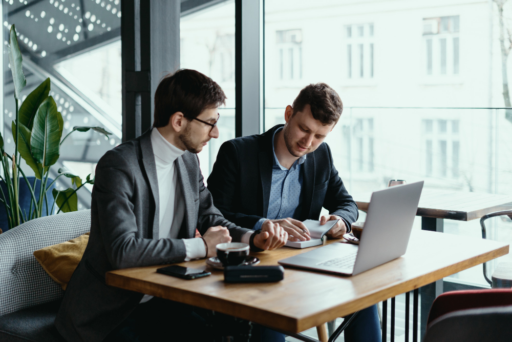 two-young-businessman-having-successful-meeting-restaurant (3)